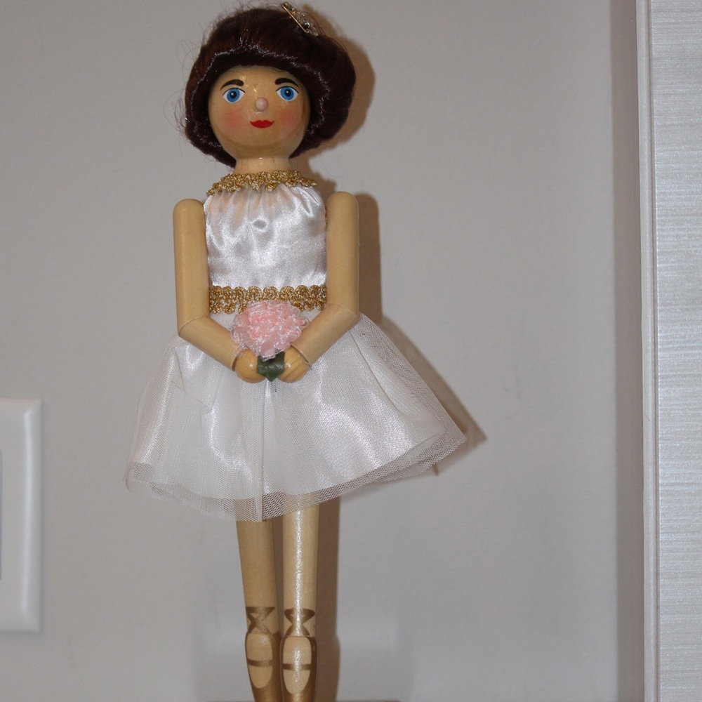 Ballerina holding bouquet figure